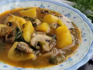 Veganistische lente stoofpot met aardappelen en champignons