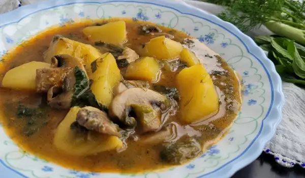 Veganistische lente stoofpot met aardappelen en champignons