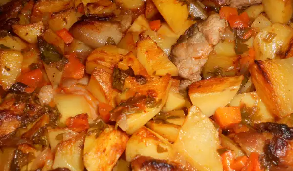 Varkensvlees met aardappelen in de oven