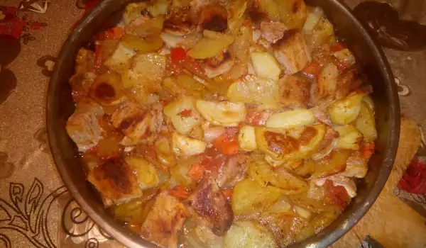 Varkensvlees met aardappelen in de oven