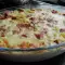 Aardappelen met gerookt vlees en roomsaus uit de oven