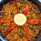 Paella met varkensvlees en verse tuinbonen