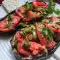 Auberginebootjes met tomaat en champignons
