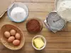 Hoeveel bakpoeder of baking soda worden toegevoegd aan 1 kg meel?